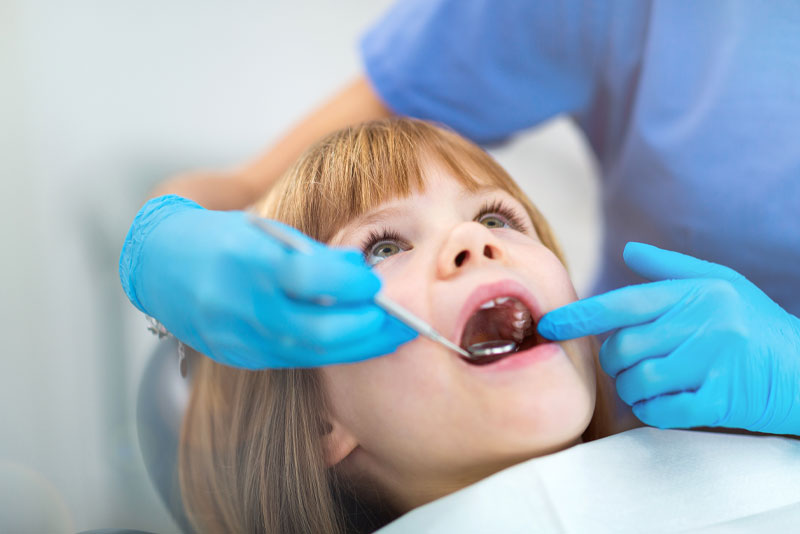 pediatric-patient undergoing dental procedure