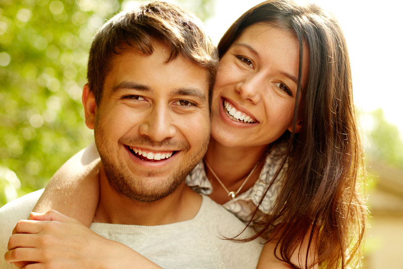 Dental Patients Smiling With Well Cared For Dental Implants In Schaumburg, IL